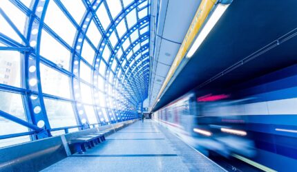 time-laps photography of blue and white train